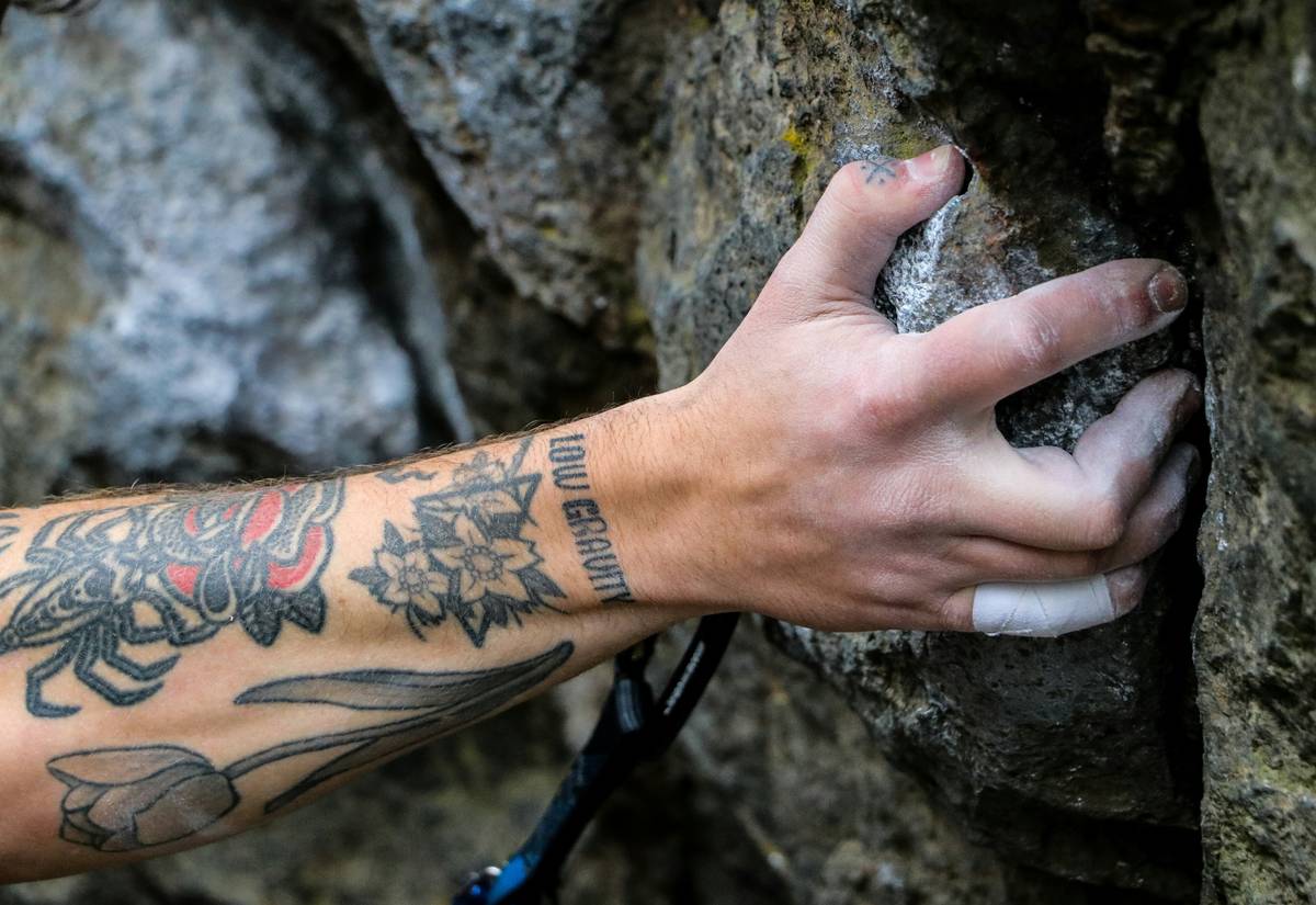 Close-up of premium climbing gloves showing strategic hand protection for climbing reinforcement zones